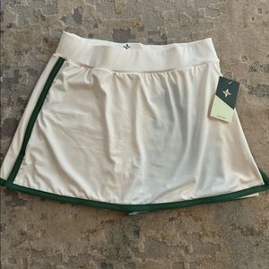 Tuckernuck white athletic skort with green gingham built in spandex shorts.